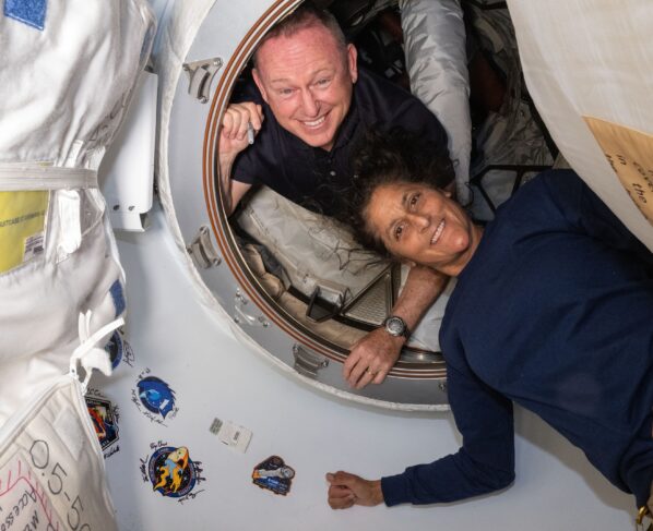 Two astronauts stay behind