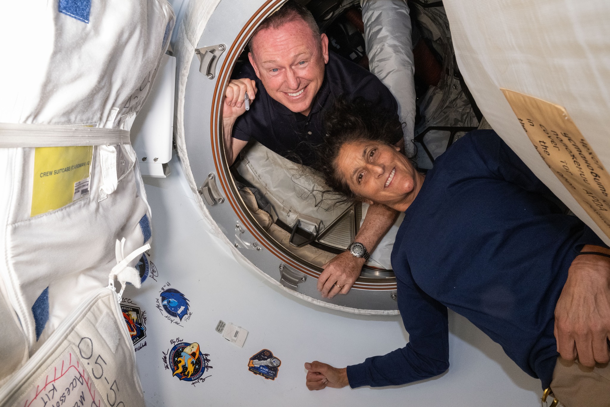 Two astronauts stay behind